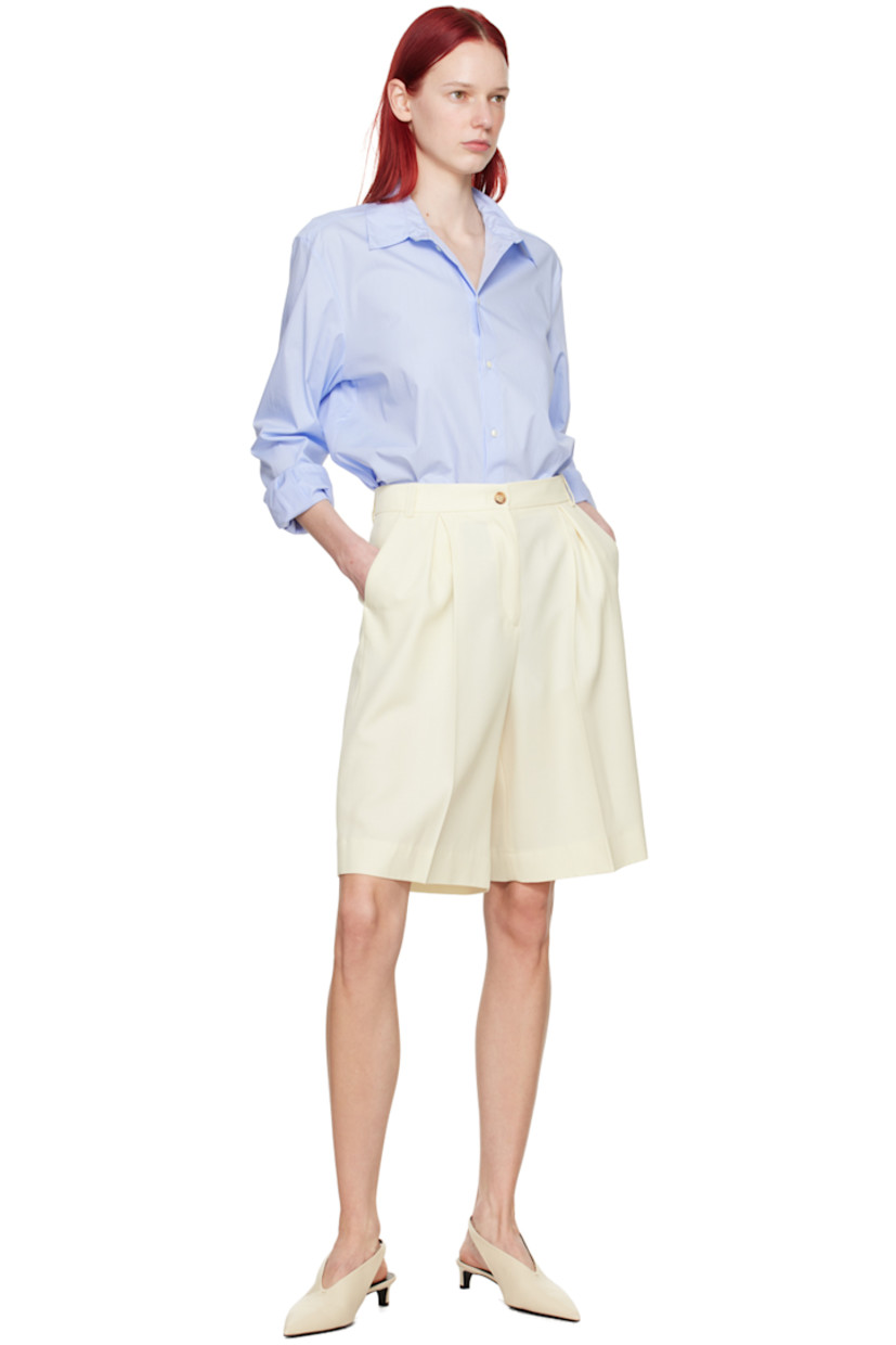 Loose-fit stretch virgin wool serge shorts.

· High-rise
· Belt loops
· Four-pocket styling
· Zip-fly
· Inverted box pleats at front
· Creased legs

Supplier color: Off white