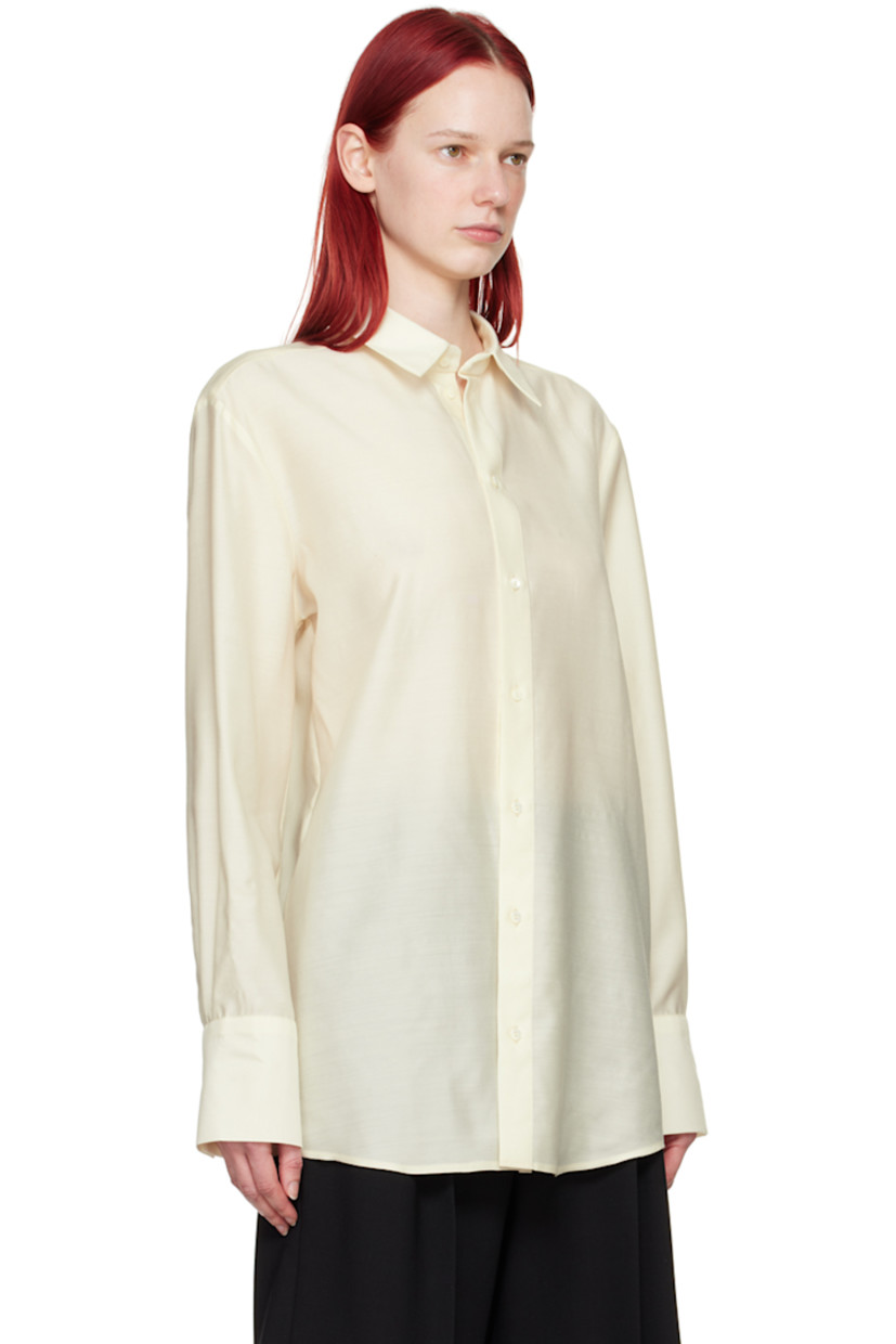 Semi-sheer virgin wool- and silk-blend twill shirt.

· Spread collar
· Button closure
· Shirttail hem
· Two-button barrel cuffs

Part of the His & Hers collection.

Supplier color: Off-white