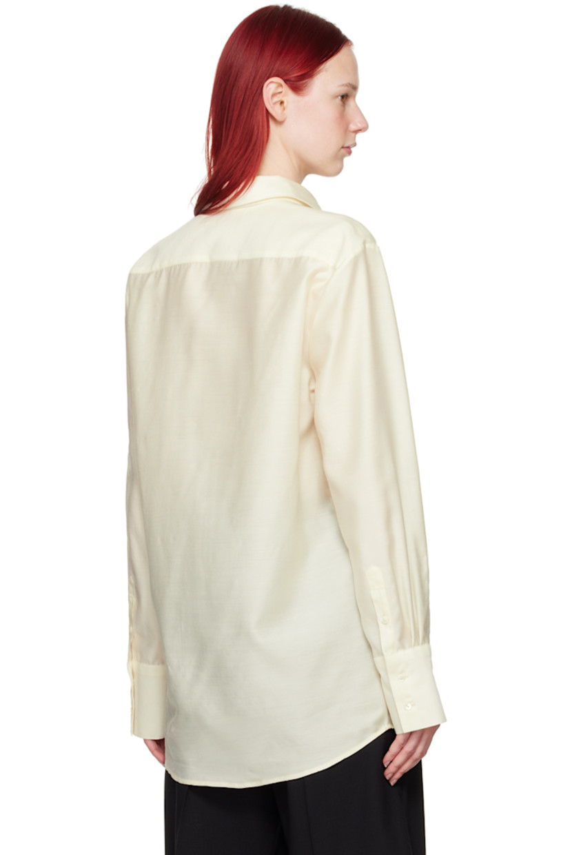 Semi-sheer virgin wool- and silk-blend twill shirt.

· Spread collar
· Button closure
· Shirttail hem
· Two-button barrel cuffs

Part of the His & Hers collection.

Supplier color: Off-white