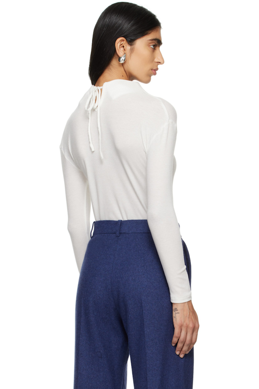Ribbed tencel jersey T-shirt.

· Structured stand collar 
· Self-tie fastening at keyhole back collar

Supplier color: White