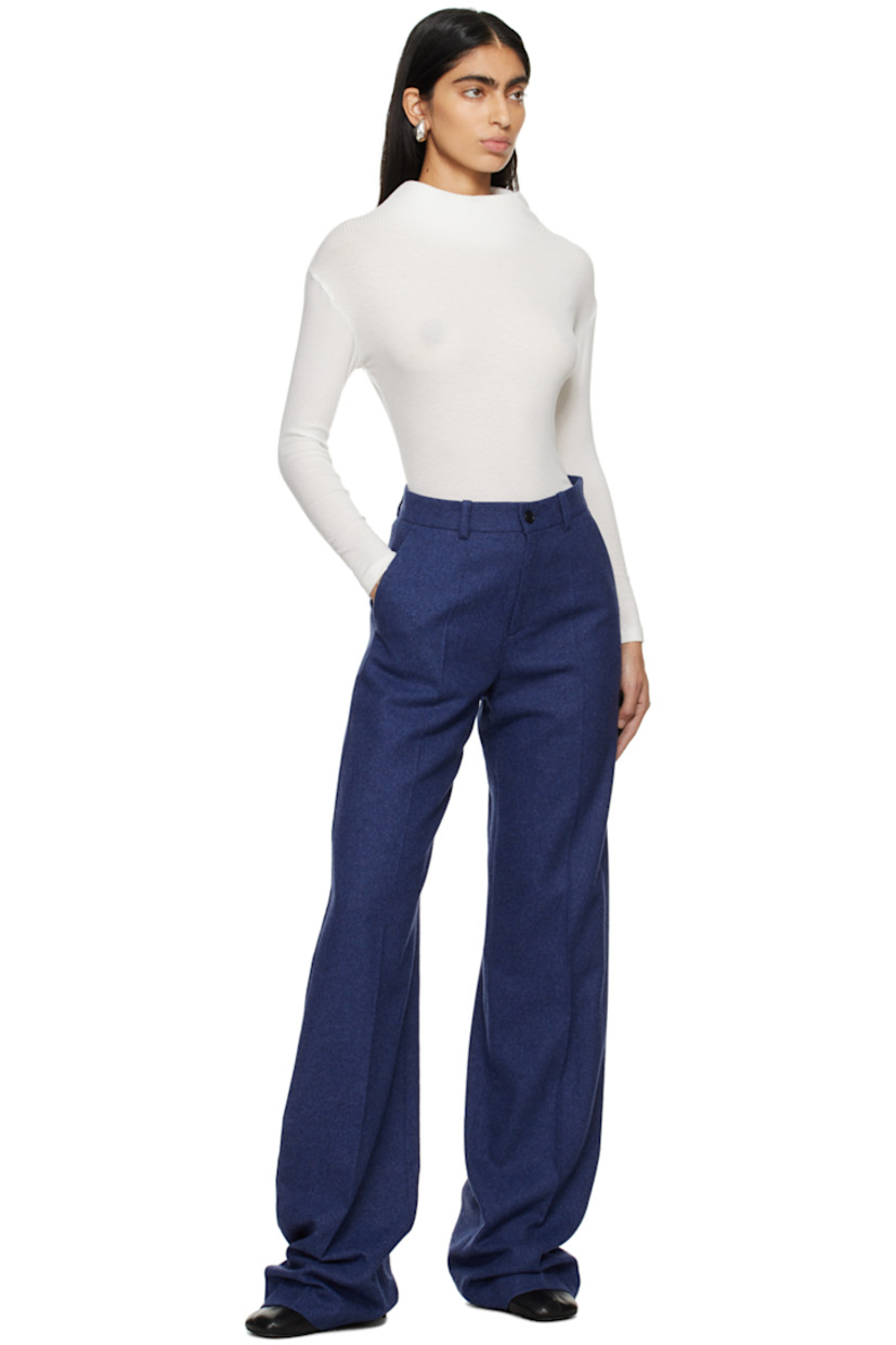 Ribbed tencel jersey T-shirt.

· Structured stand collar 
· Self-tie fastening at keyhole back collar

Supplier color: White