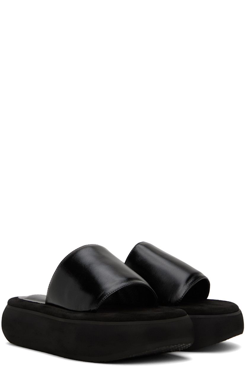 Crinkled leather slides in black.

· Open square toe
· Logo-embossed padded leather and suede footbed
· Grained leather lining
· Platform EVA foam rubber midsole
· Treaded rubber sole
· Platform: H2"

Supplier color: Washed black
