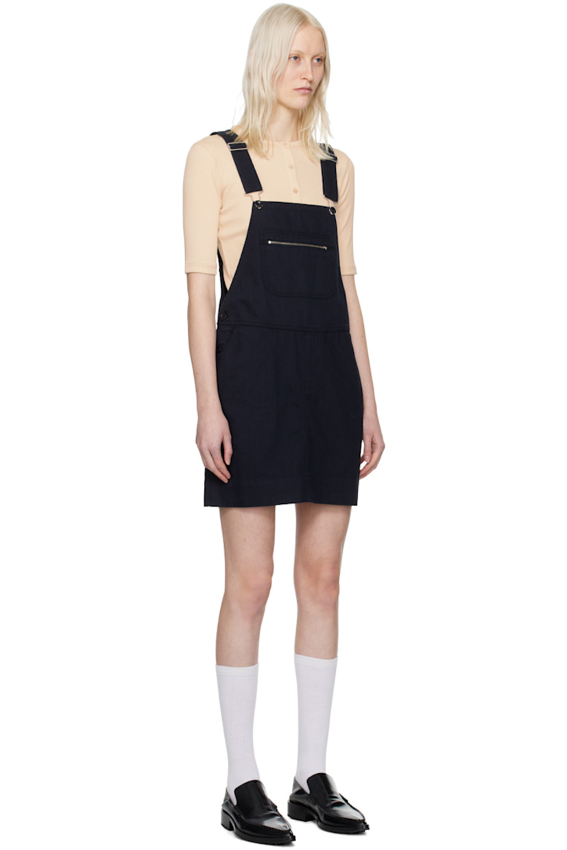 Washed cotton twill dress.

· Square neck
· Zip-pocket at chest
· Four-pocket styling
· Mock-fly
· Buttoned vent at side seams
· Adjustable shoulder straps 

Supplier color: Dark navy