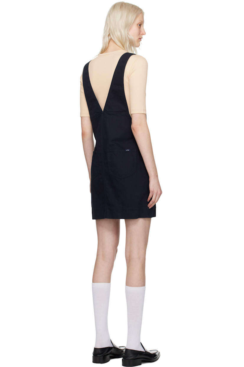 Washed cotton twill dress.

· Square neck
· Zip-pocket at chest
· Four-pocket styling
· Mock-fly
· Buttoned vent at side seams
· Adjustable shoulder straps 

Supplier color: Dark navy