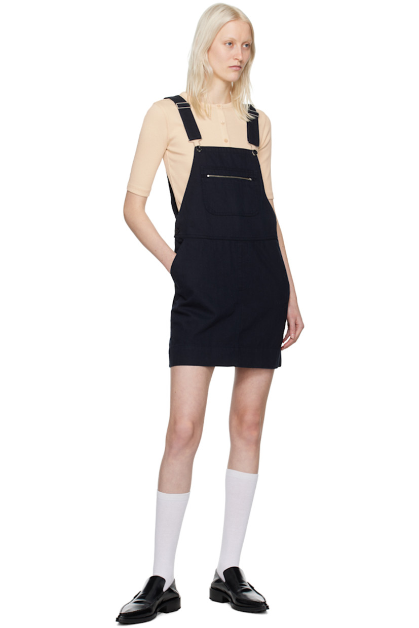 Washed cotton twill dress.

· Square neck
· Zip-pocket at chest
· Four-pocket styling
· Mock-fly
· Buttoned vent at side seams
· Adjustable shoulder straps 

Supplier color: Dark navy