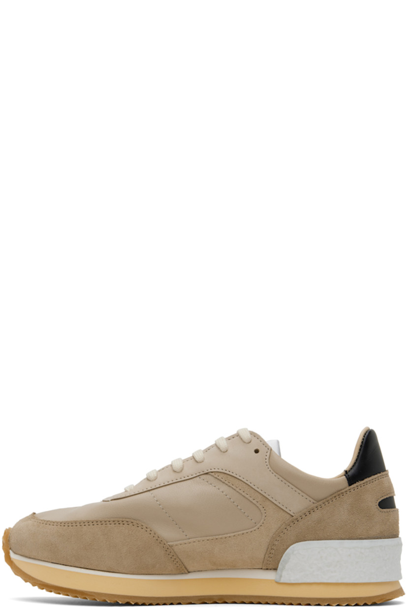 Low-top paneled grained leather, suede, and buffed leather sneakers in taupe.

· Perforated detailing at toe
· Lace-up closure 
· Logo patch at tongue
· Padded collar
· Buffed leather and suede lining
· Stacked foam rubber midsole
· Treaded rubber sole

Supplier color: Sand