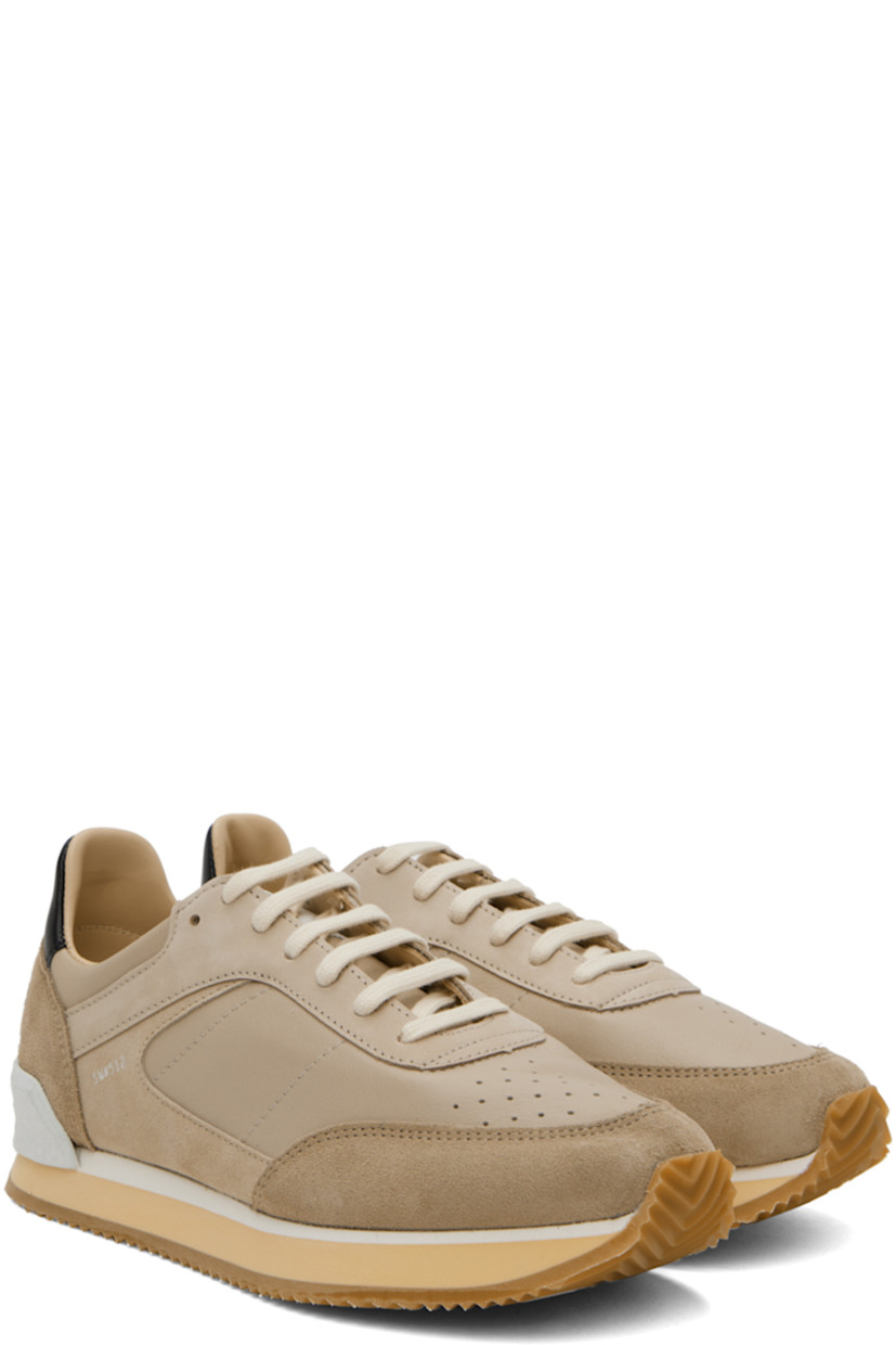 Low-top paneled grained leather, suede, and buffed leather sneakers in taupe.

· Perforated detailing at toe
· Lace-up closure 
· Logo patch at tongue
· Padded collar
· Buffed leather and suede lining
· Stacked foam rubber midsole
· Treaded rubber sole

Supplier color: Sand