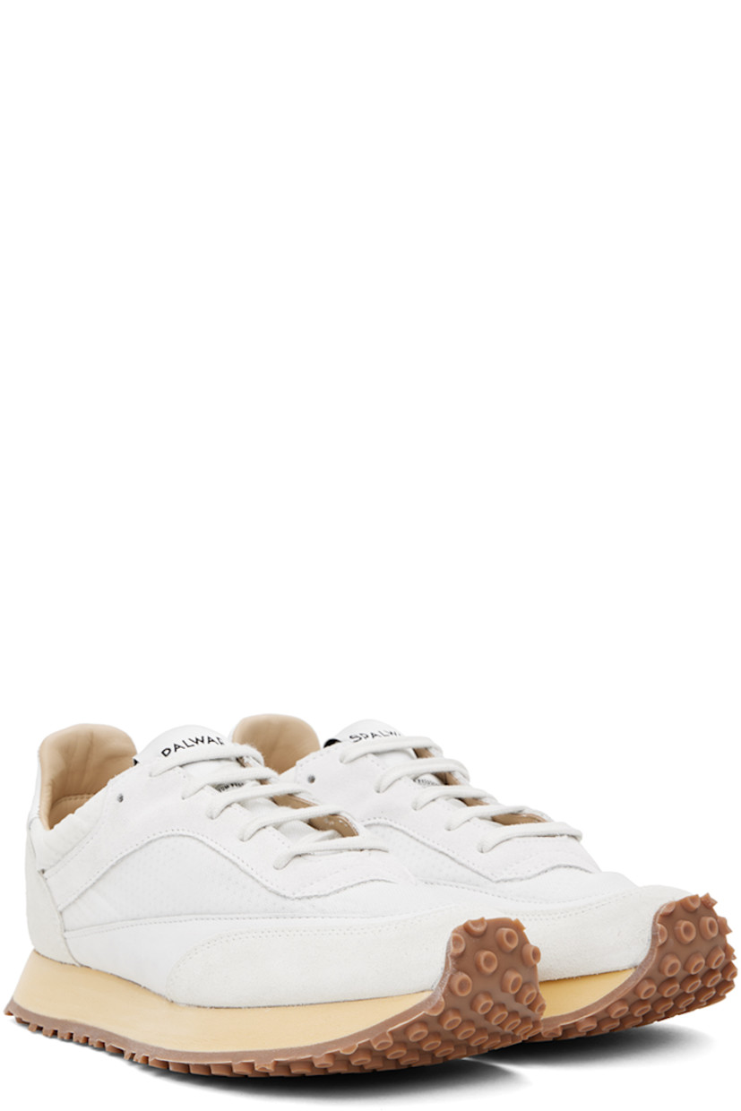 Low-top paneled suede, nubuck, and mesh sneakers in white. 

· Lace-up closure
· Logo patch at padded tongue
· Padded collar
· Logo-embossed padded leather footbed
· Buffed leather and mesh lining
· Foam rubber midsole
· Treaded rubber outsole

Supplier color: White
