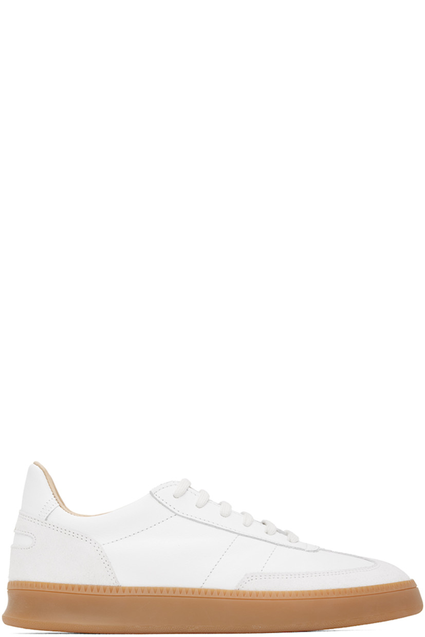 Low-top buffed nappa leather and suede sneakers in white.

· Lace-up closure
· Logo patch at padded tongue
· Padded collar
· Perforated detailing at inner side
· Logo-embossed padded leather footbed
· Buffed leather and mesh lining
· Treaded rubber sole

Supplier color: White