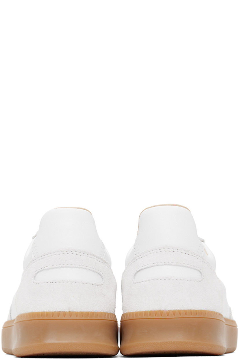 Low-top buffed nappa leather and suede sneakers in white.

· Lace-up closure
· Logo patch at padded tongue
· Padded collar
· Perforated detailing at inner side
· Logo-embossed padded leather footbed
· Buffed leather and mesh lining
· Treaded rubber sole

Supplier color: White