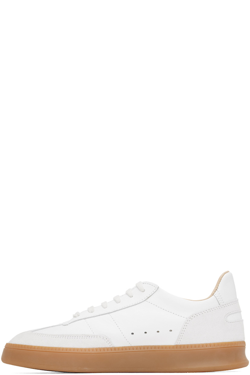 Low-top buffed nappa leather and suede sneakers in white.

· Lace-up closure
· Logo patch at padded tongue
· Padded collar
· Perforated detailing at inner side
· Logo-embossed padded leather footbed
· Buffed leather and mesh lining
· Treaded rubber sole

Supplier color: White