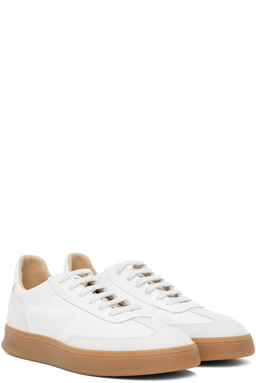 Low-top buffed nappa leather and suede sneakers in white.

· Lace-up closure
· Logo patch at padded tongue
· Padded collar
· Perforated detailing at inner side
· Logo-embossed padded leather footbed
· Buffed leather and mesh lining
· Treaded rubber sole

Supplier color: White