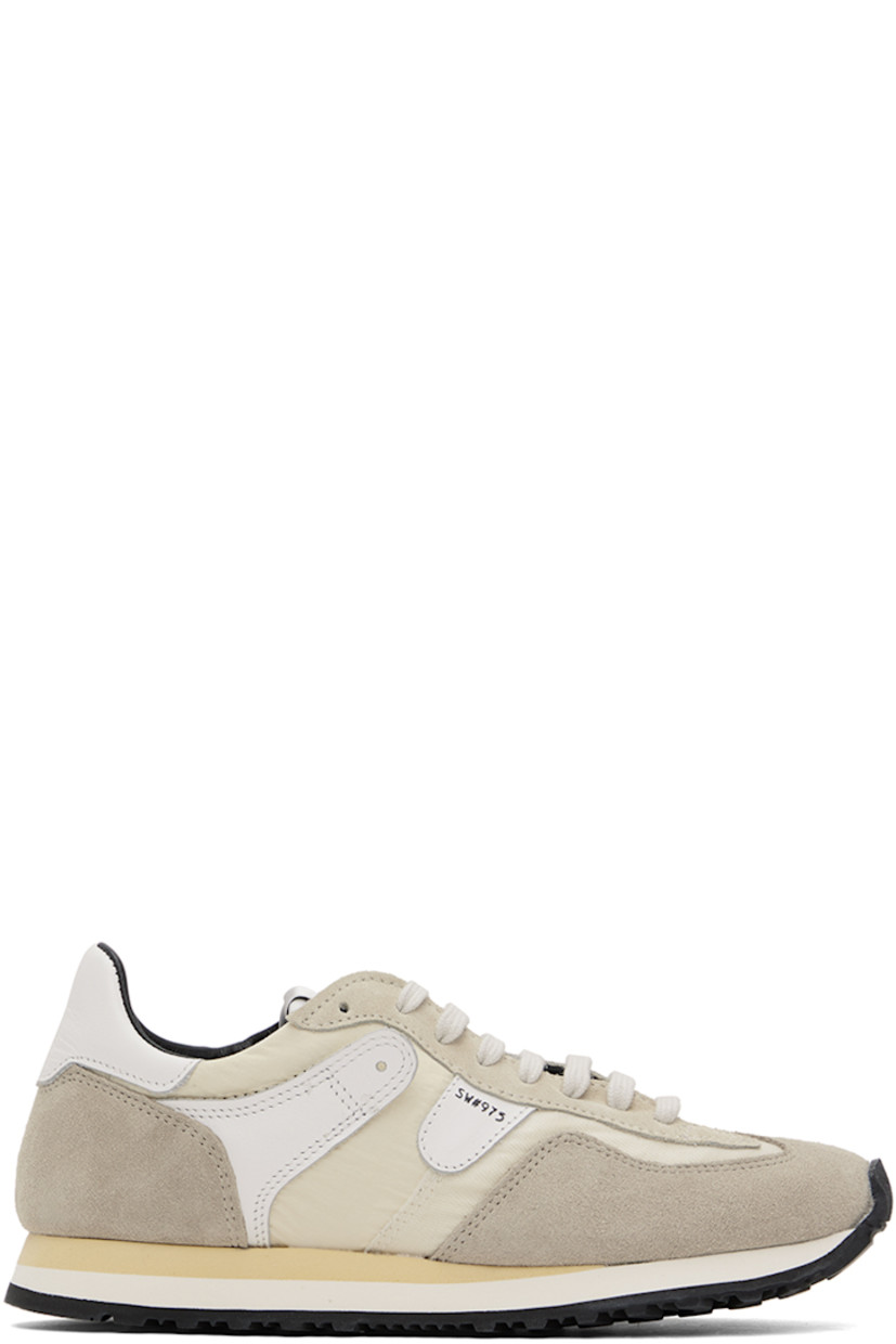 Low-top paneled ripstop, canvas, suede, and buffed leather sneakers in tones of beige.

· Lace-up closure
· Logo patch at padded tongue
· Padded collar
· Text stamped at outer side
· Buffed calfskin and mesh lining
· Stacked foam rubber midsole
· Treaded rubber sole

Supplier color: Sand