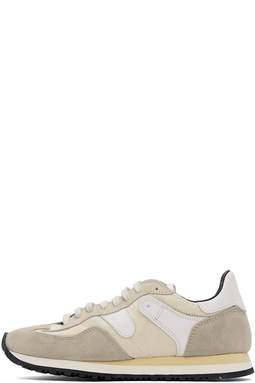 Low-top paneled ripstop, canvas, suede, and buffed leather sneakers in tones of beige.

· Lace-up closure
· Logo patch at padded tongue
· Padded collar
· Text stamped at outer side
· Buffed calfskin and mesh lining
· Stacked foam rubber midsole
· Treaded rubber sole

Supplier color: Sand