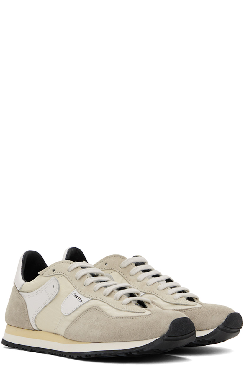 Low-top paneled ripstop, canvas, suede, and buffed leather sneakers in tones of beige.

· Lace-up closure
· Logo patch at padded tongue
· Padded collar
· Text stamped at outer side
· Buffed calfskin and mesh lining
· Stacked foam rubber midsole
· Treaded rubber sole

Supplier color: Sand
