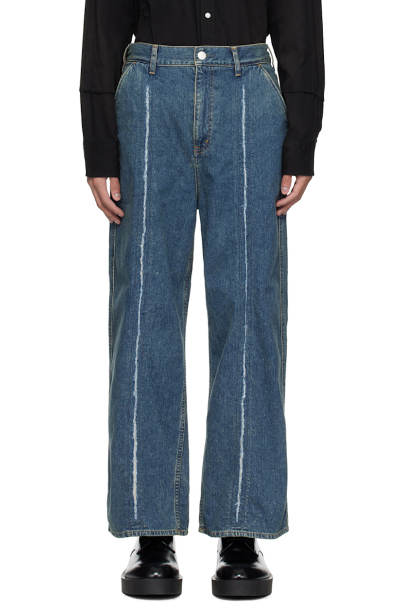 Loose-fit wide-leg non-stretch denim jeans. Subtle fading throughout.

· Paneled construction
· Belt loops
· Four-pocket styling
· Zip-fly
· Central raw edge at front legs
· Leather logo patch at back waistband
· Logo flag at back pocket
· Logo-engraved silver-tone hardware
· Contrast stitching in orange

Supplier color: Indigo