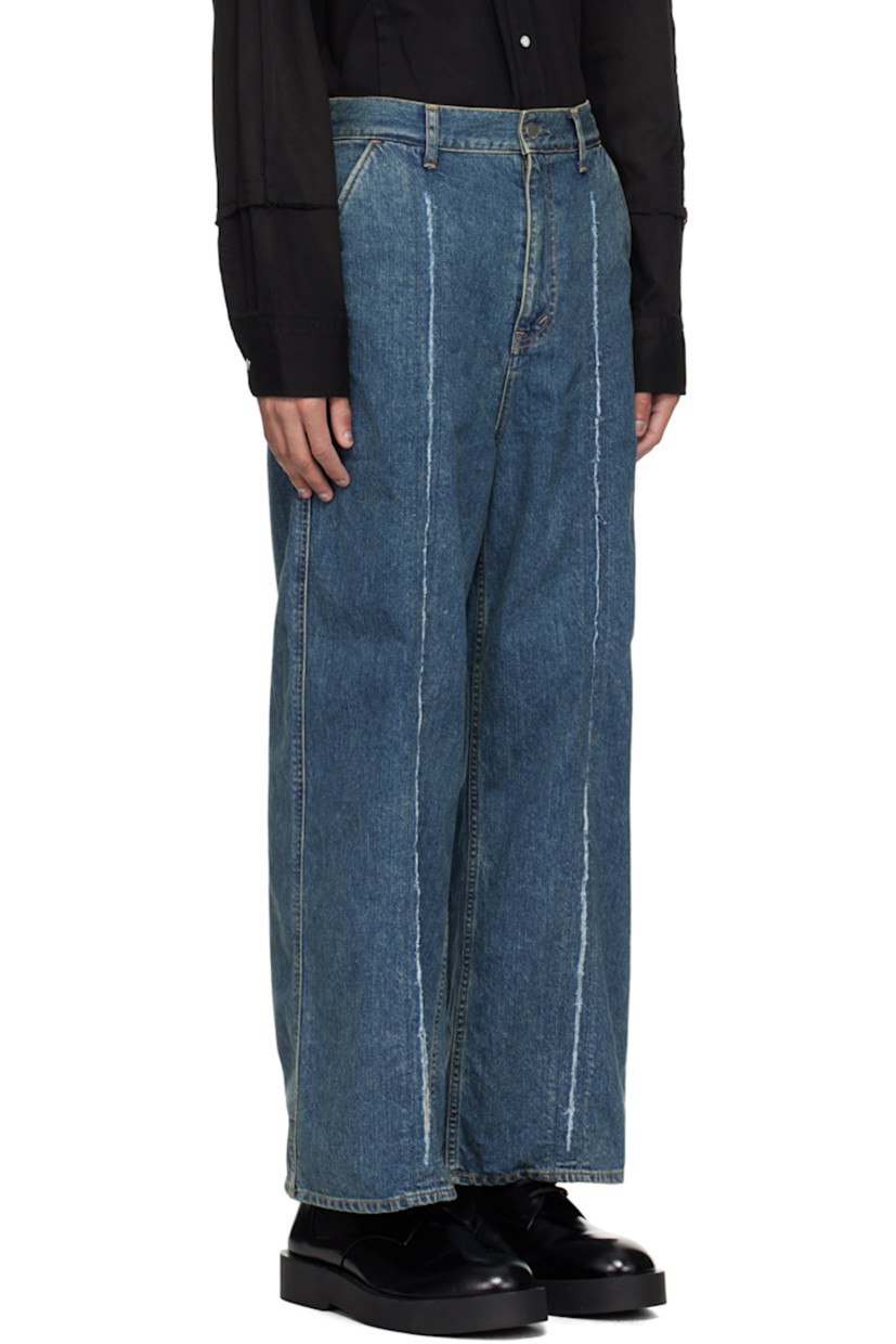 Loose-fit wide-leg non-stretch denim jeans. Subtle fading throughout.

· Paneled construction
· Belt loops
· Four-pocket styling
· Zip-fly
· Central raw edge at front legs
· Leather logo patch at back waistband
· Logo flag at back pocket
· Logo-engraved silver-tone hardware
· Contrast stitching in orange

Supplier color: Indigo