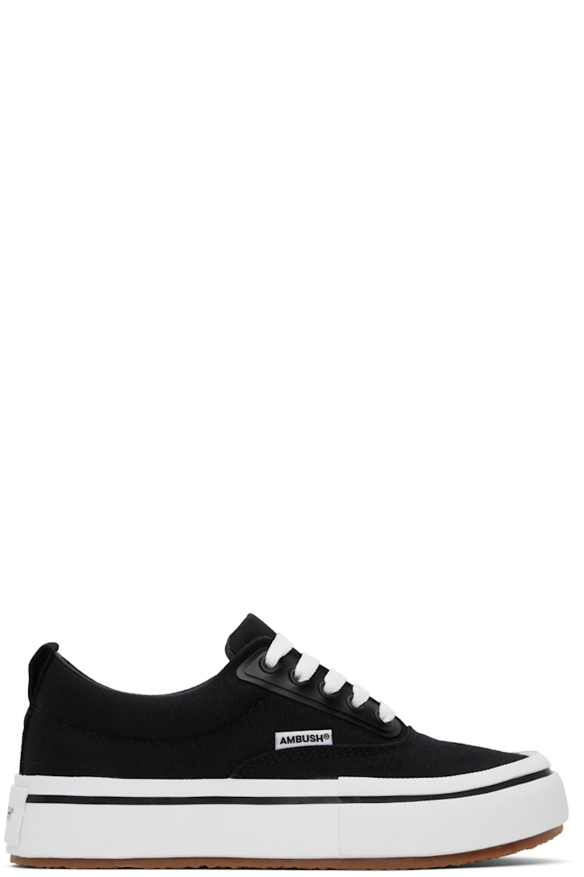 Low-top cotton canvas sneakers in black. 

· Lace-up closure
· Padded tongue and collar
· Logo flag at outer side
· Pull-loop at heel tab
· Logo printed at heel
· Grained leather lining
· Textured rubber platform midsole
· Treaded rubber sole
· Platform: H1.5"

Supplier color: Black