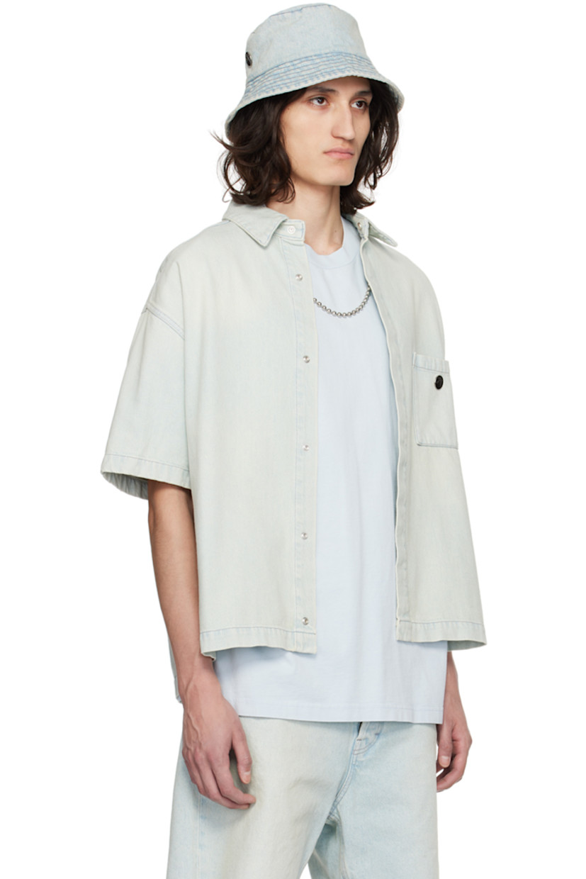 Non-stretch denim shirt. Fading throughout.

· Spread collar
· Concealed press-stud closure
· Logo hardware at patch pocket
· Shirttail hem
· Single-press-stud barrel cuffs
· Contrast stitching in gray

Supplier color: Light blue