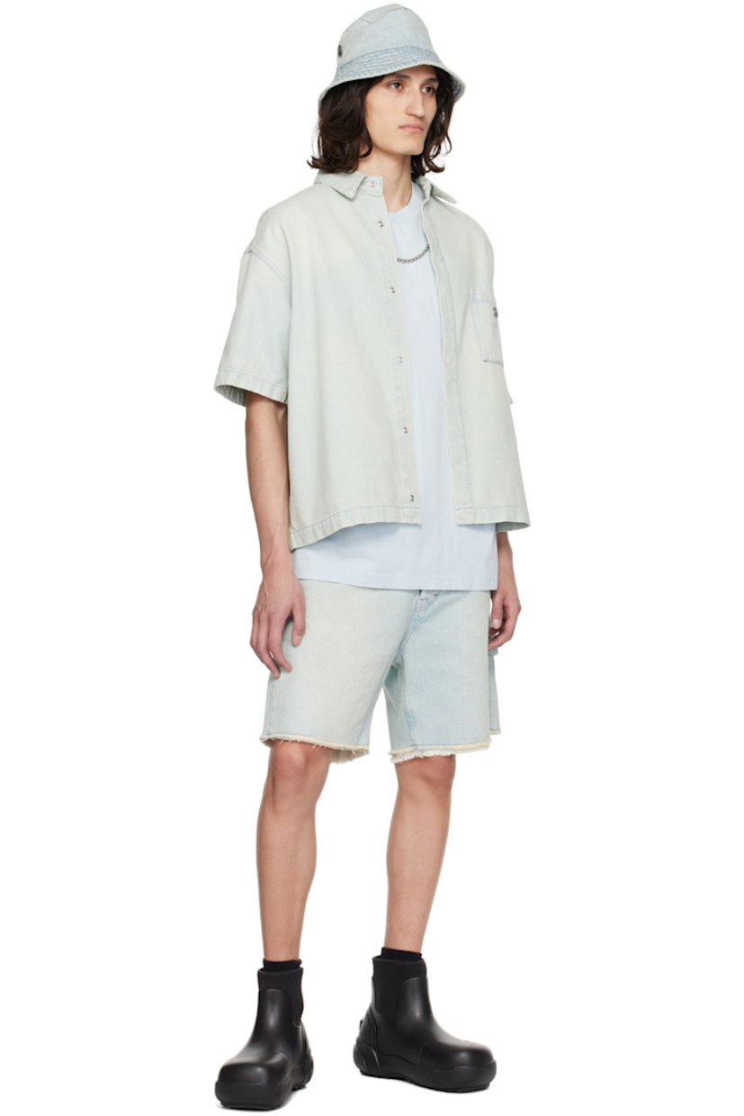 Non-stretch denim shirt. Fading throughout.

· Spread collar
· Concealed press-stud closure
· Logo hardware at patch pocket
· Shirttail hem
· Single-press-stud barrel cuffs
· Contrast stitching in gray

Supplier color: Light blue