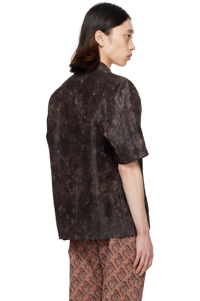 Nylon- and rayon-blend sateen shirt. Graphic pattern printed throughout.

· Open spread collar
· Button closure
· Patch pockets

Supplier color: Brown