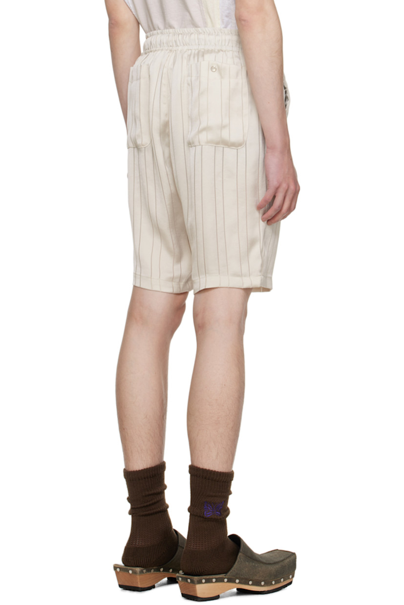 Triacetate- and cupro-blend georgette shorts. Jacquard stripes throughout.

· Drawstring at elasticized waistband
· Four-pocket styling
· Mock-fly
· Logo graphic embroidered at front

Supplier color: Beige