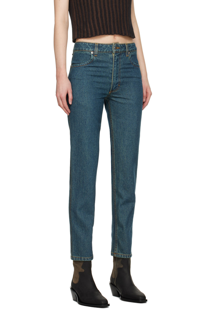 Overdyed enzyme-washed non-stretch denim jeans. Fading throughout.

· Low-rise
· Belt loops
· Four-pocket styling
· Zip-fly
· Logo-engraved silver-tone hardware 
· Contrast stitching in tan 

Supplier color: New blue