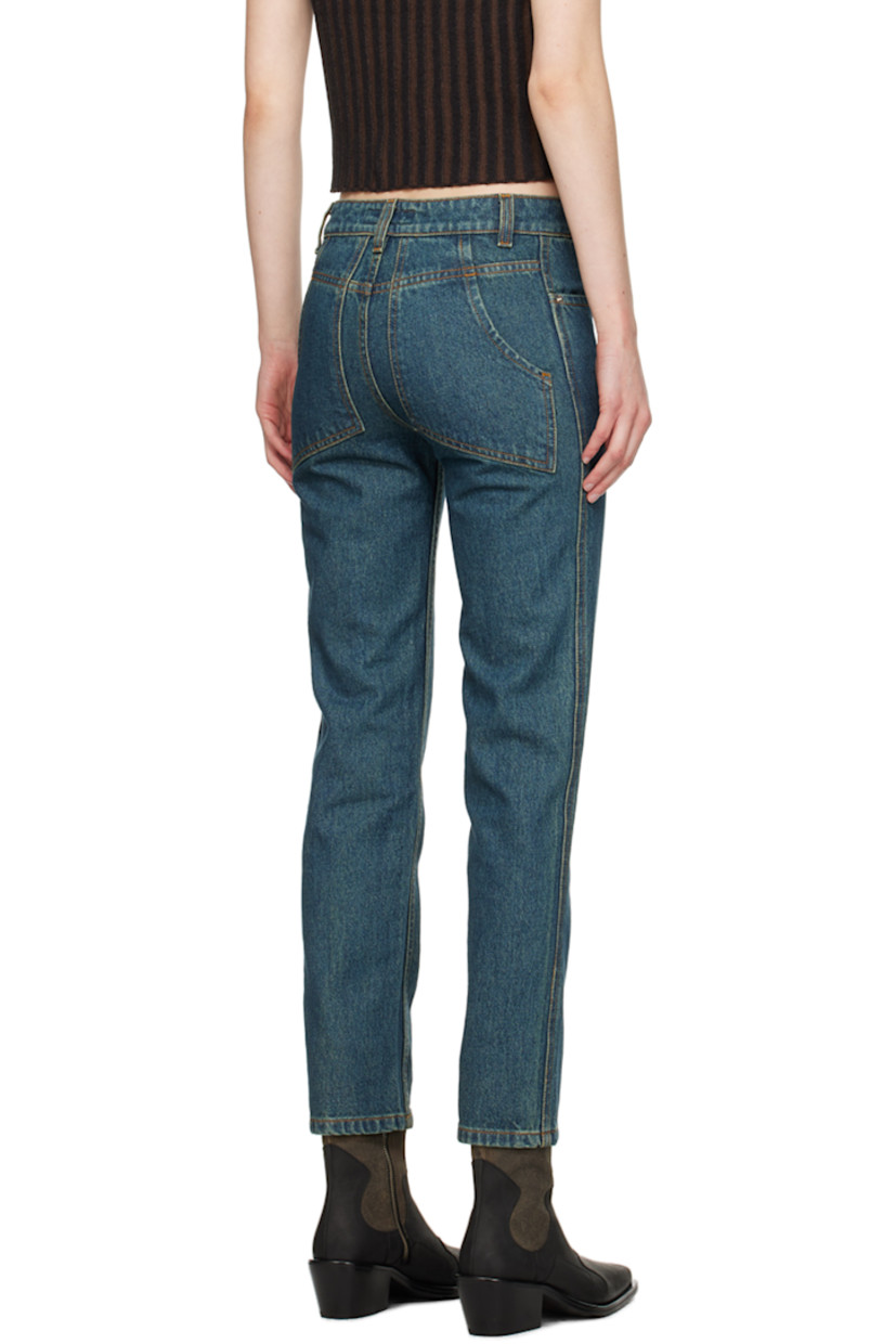 Overdyed enzyme-washed non-stretch denim jeans. Fading throughout.

· Low-rise
· Belt loops
· Four-pocket styling
· Zip-fly
· Logo-engraved silver-tone hardware 
· Contrast stitching in tan 

Supplier color: New blue