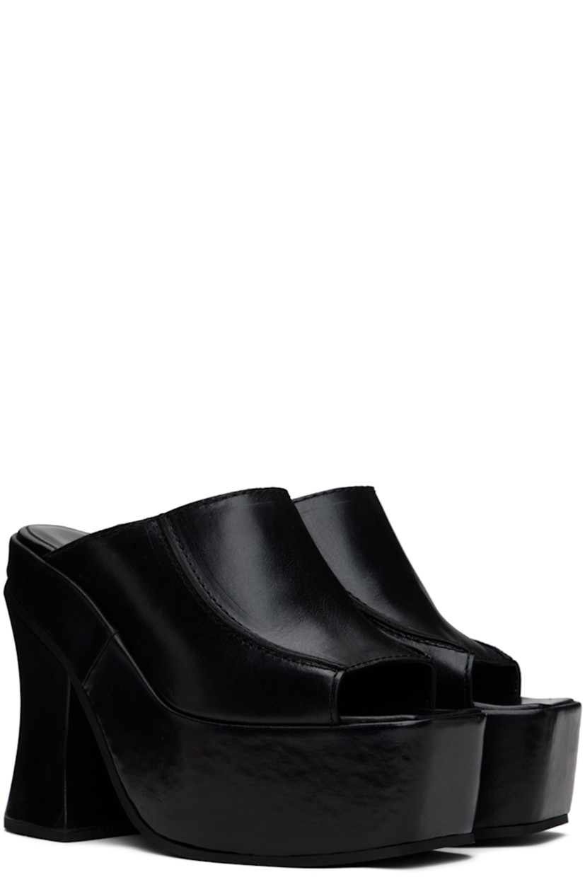 Grained leather mules in black.

· Open square toe
· Pinched seams at vamp
· Logo embossed at padded footbed
· Covered block heel 
· Platform midsole
· Foam rubber sole
· Platform: H2.25" 
· Heel: H5"

Supplier color: Black