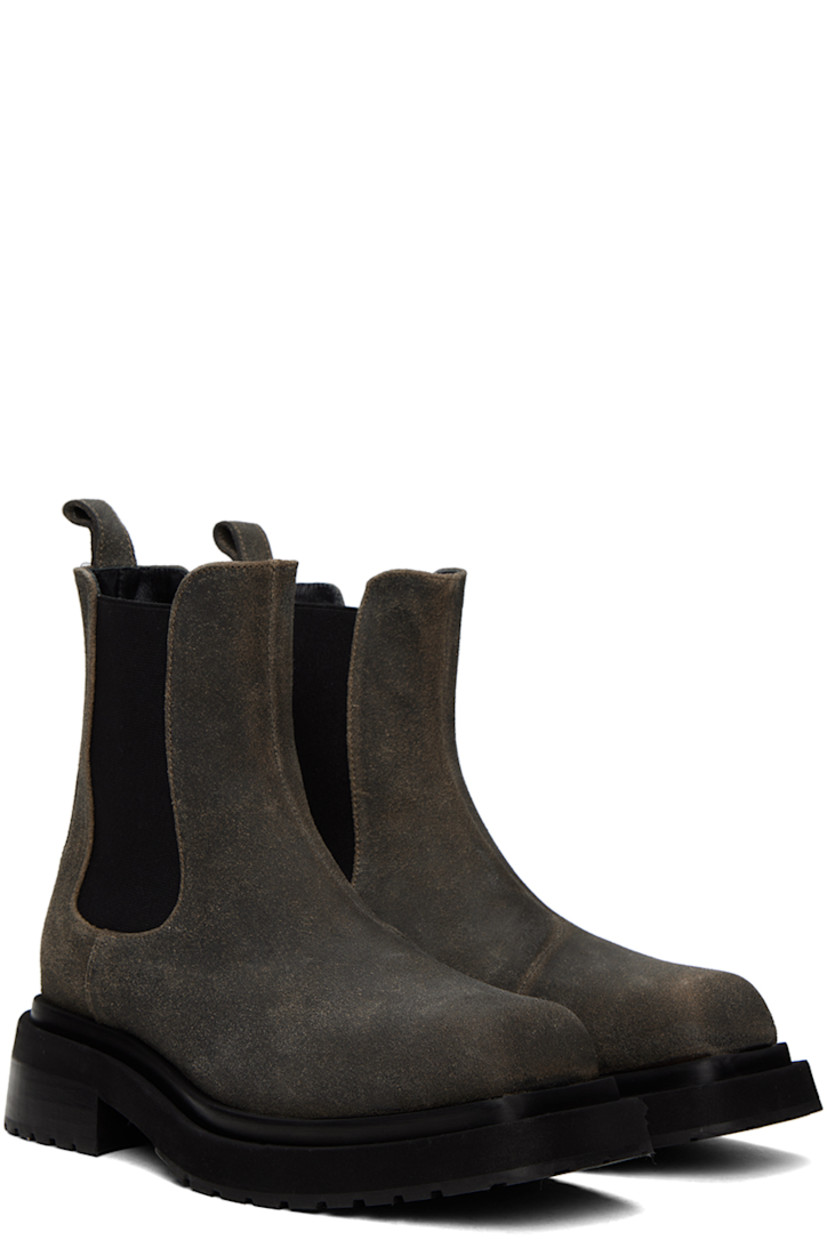 Ankle-high suede Chelsea boots in gray.

· Square toe
· Pull-loop at heel collar
· Elasticized gusset at sides
· Grained leather lining 
· Rubber injection at block heel
· Treaded rubber sole
· Heel: H1.5"

Supplier color: Gray