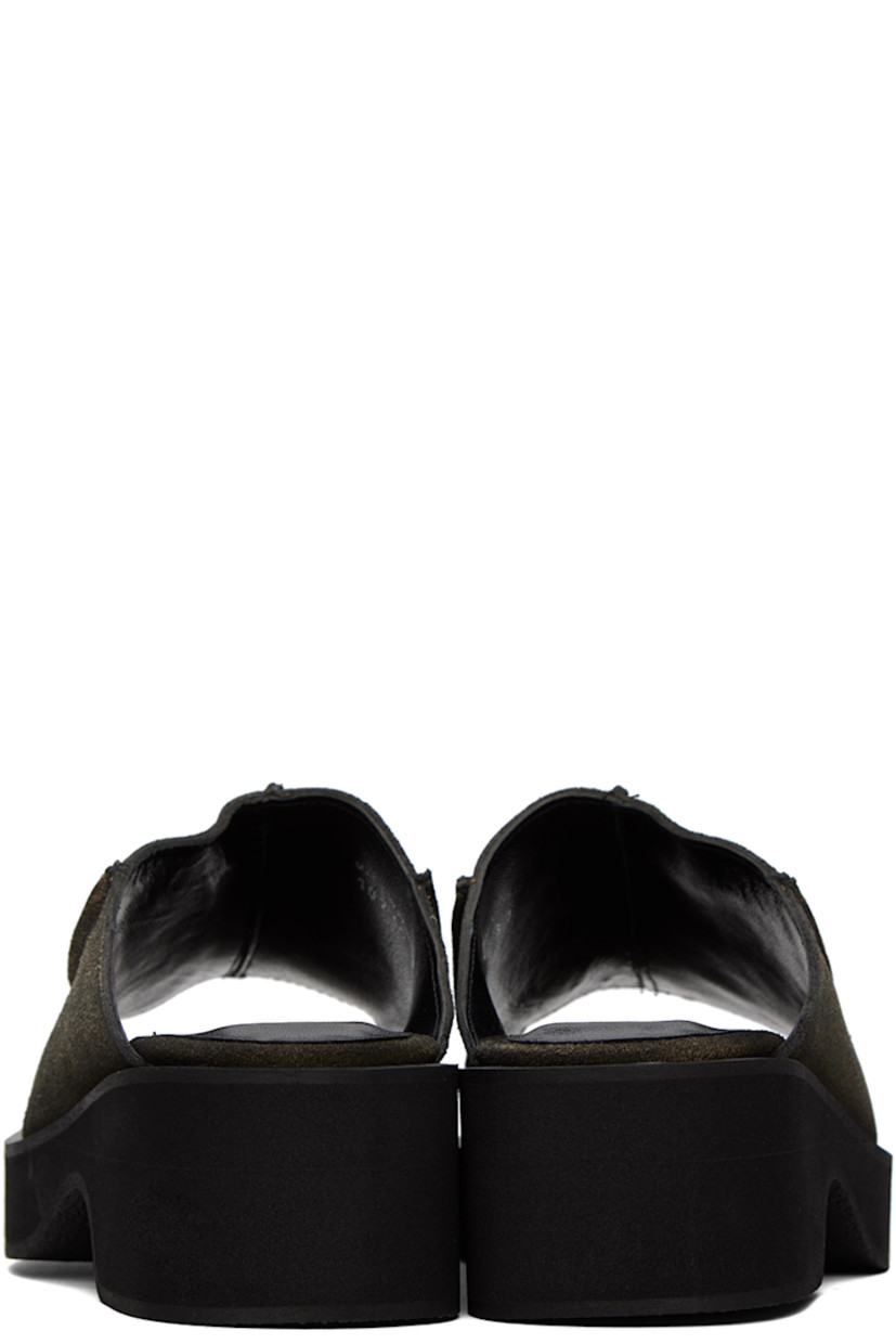 Suede slip-on sandals in gray. 

· Open square toe
· Pinched seams at vamp
· Logo embossed at padded leather footbed
· Grained leather lining
· Foam rubber block heel
· Treaded foam rubber platform sole
· Platform: H1"
· Heel: H2"

Supplier color: Gray