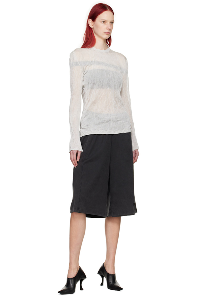 Semi-sheer ENKA- and FSC-certified crinkled knit viscose- and steel-blend T-shirt. 

· Rib knit crewneck, hem, and cuffs 
· Logo embroidered at back collar

Supplier color: White