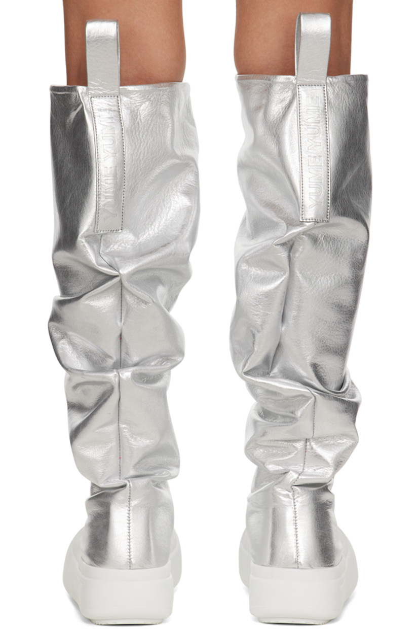 Knee-high laminated grained faux-leather boots in metallic silver tone.

· Gathering throughout
· Rubber cap toe
· Pull-loops at heel collar
· Logo embossed at heel tab
· Padded footbed
· Jersey lining
· Logo embossed at rubber midsole
· Treaded rubber sole
· Platform: H1.75" 

Supplier color: Metallic