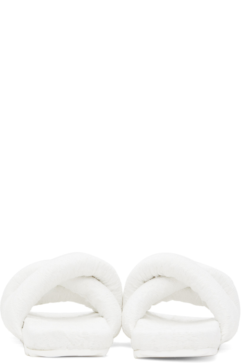 Padded brocade slip-on sandals in white.

· Jacquard graphic pattern throughout
· Open square toe
· Criss-crossing straps at vamp
· Logo embossed at EVA foam footbed
· Treaded rubber sole

Supplier color: White