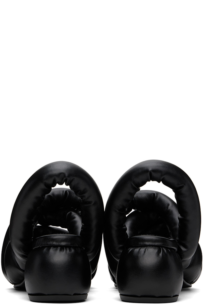 Padded buffed faux-leather heeled sandals in black.

· Open square toe
· Criss-crossing straps at vamp
· Slingback strap
· Logo embossed at padded footbed
· Covered block heel with rubber injection
· Treaded rubber sole
· Heel: H2.5"

Supplier color: Black