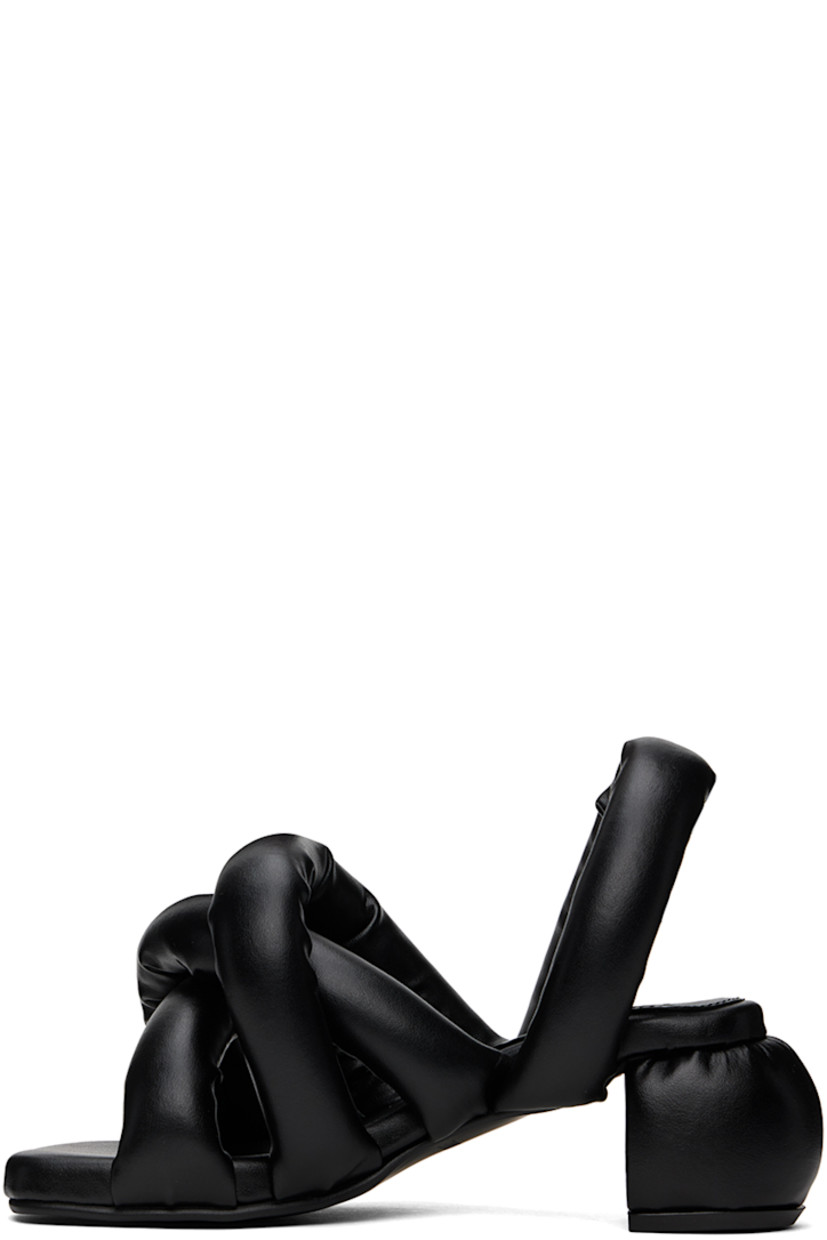 Padded buffed faux-leather heeled sandals in black.

· Open square toe
· Criss-crossing straps at vamp
· Slingback strap
· Logo embossed at padded footbed
· Covered block heel with rubber injection
· Treaded rubber sole
· Heel: H2.5"

Supplier color: Black