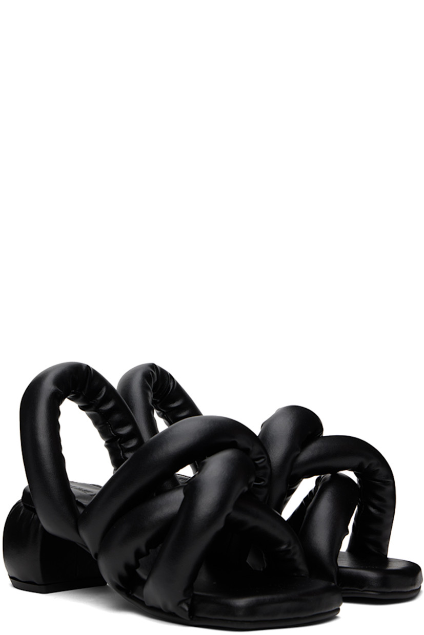 Padded buffed faux-leather heeled sandals in black.

· Open square toe
· Criss-crossing straps at vamp
· Slingback strap
· Logo embossed at padded footbed
· Covered block heel with rubber injection
· Treaded rubber sole
· Heel: H2.5"

Supplier color: Black
