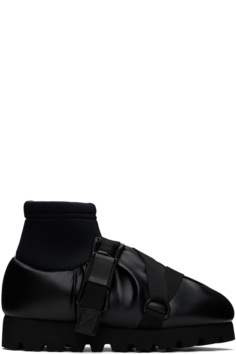 Ankle-high padded buffed faux-leather boots in black. 

· Gathering throughout
· Criss-crossing webbing cinch straps at vamp
· Logo flag at vamp
· Bonded jersey sock-style collar
· Pull-loop at heel collar
· Logo printed at padded footbed
· Jersey lining 
· EVA foam rubber platform midsole
· Treaded rubber sole
· Platform: H1.5"

Supplier color: Black