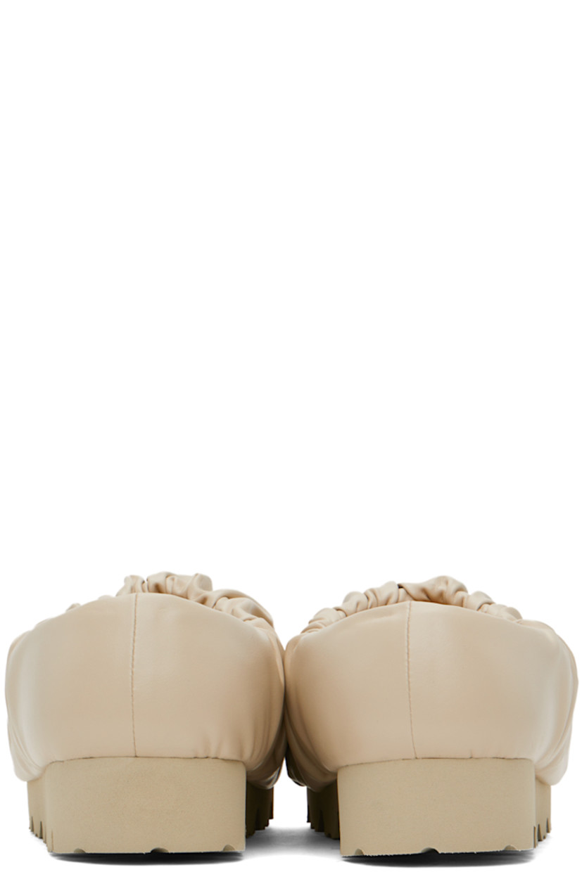Buffed faux-leather loafers in beige. 

· Gathering throughout
· Logo printed at padded footbed
· Jersey lining 
· Treaded EVA foam rubber platform sole
· Platform: H1.5"

Supplier color: Beige