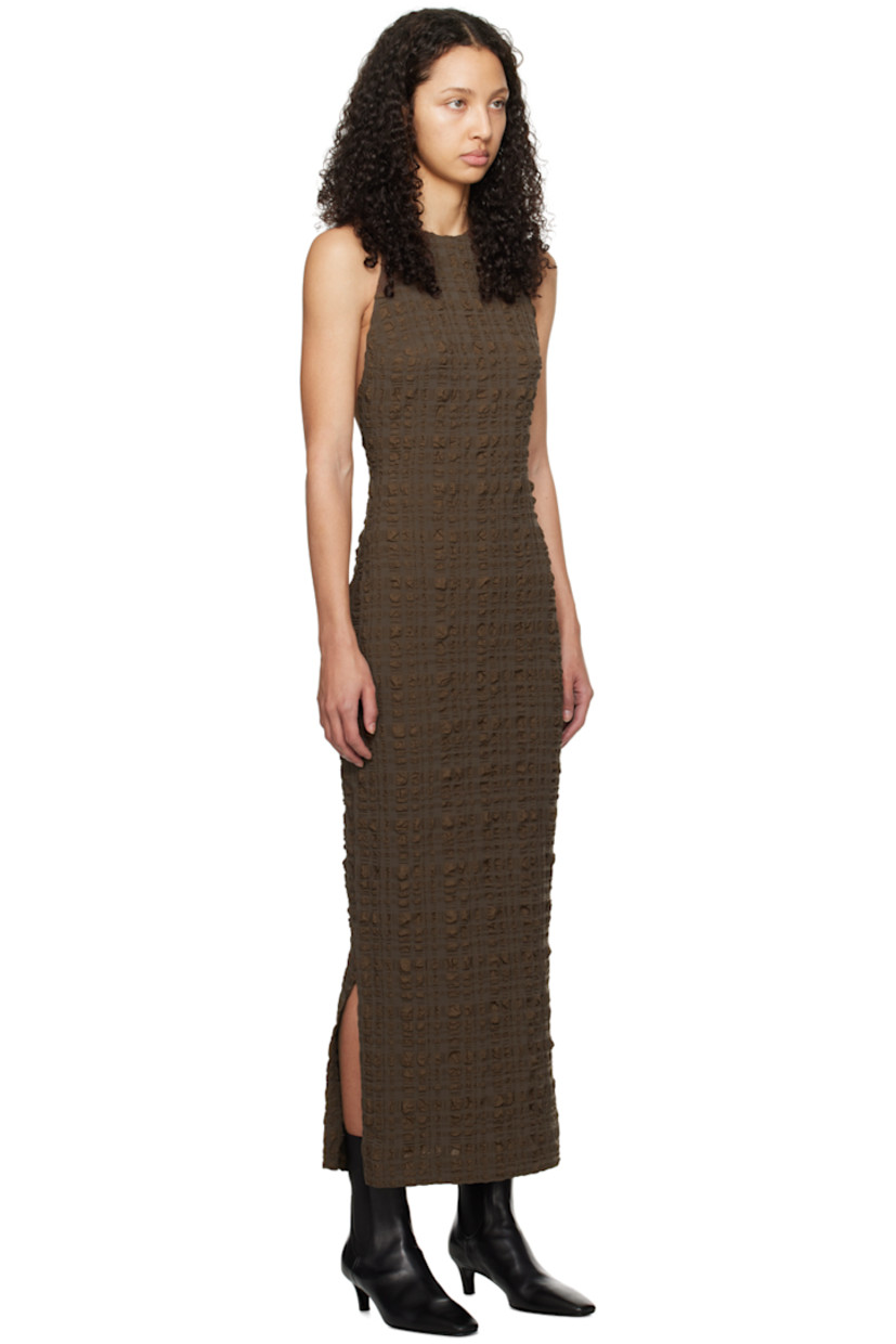Stretch polyester- and nylon-blend seersucker dress.

· Crewneck
· Slit at side seams
· Button fastening at shoulder
· Open back
· Unlined

Supplier color: Dark brown