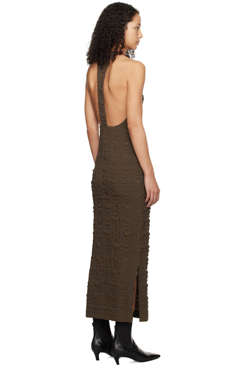 Stretch polyester- and nylon-blend seersucker dress.

· Crewneck
· Slit at side seams
· Button fastening at shoulder
· Open back
· Unlined

Supplier color: Dark brown