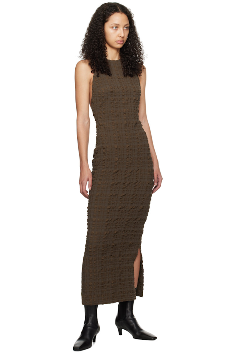 Stretch polyester- and nylon-blend seersucker dress.

· Crewneck
· Slit at side seams
· Button fastening at shoulder
· Open back
· Unlined

Supplier color: Dark brown