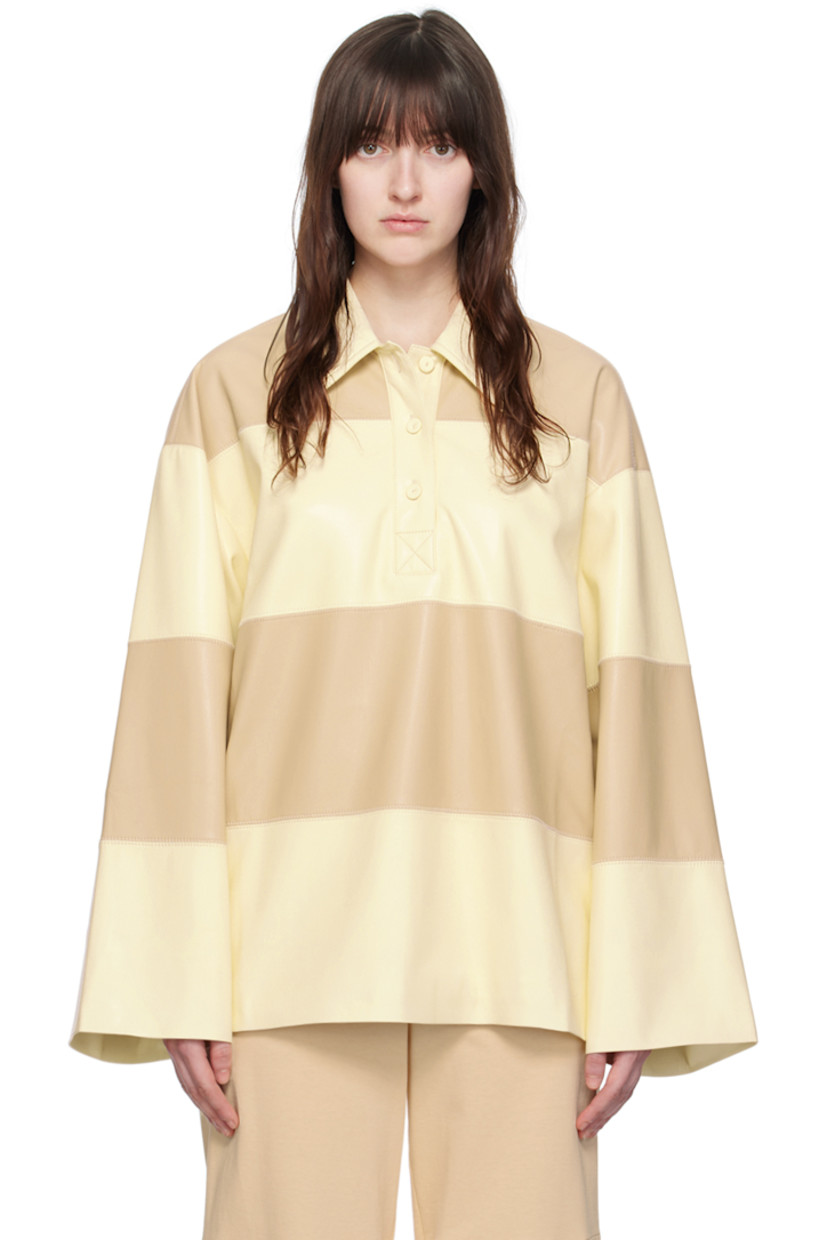 Deadstock OKOBOR™ grained vegan leather polo. 

· Paneled construction
· Spread collar
· Three-button placket
· Button vent at side seams 
· Bell sleeves
· Full viscose twill lining 

Supplier color: Eggshell/Vanilla