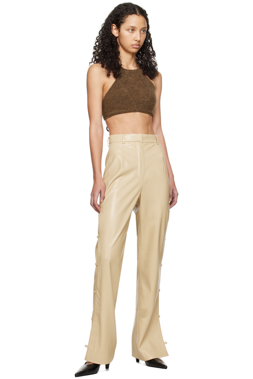 Brushed knit acrylic- and nylon-blend bralette-style camisole.

· Self-tie strap at halter neck
· Cropped hem
· Self-tie strap at open back

Supplier color: Dark brown