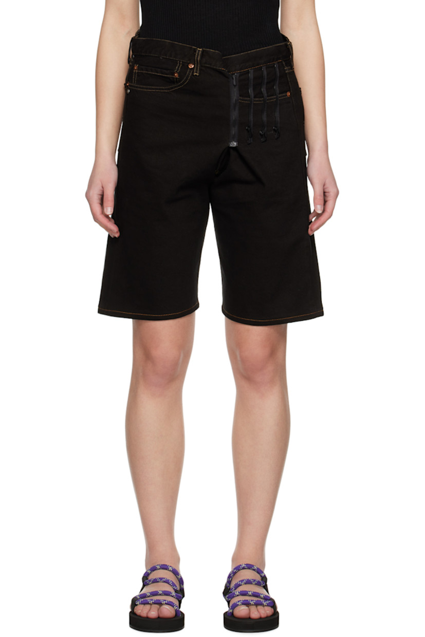 Upcycled non-stretch denim shorts. Zip detailing throughout. 

· Belt loops
· Five-pocket styling 
· Button-fly
· Distressed logo patch at back waistband 
· Logo flag at back pocket
· Logo-engraved hardware 
· Contrast stitching in beige

Supplier color: Denim black