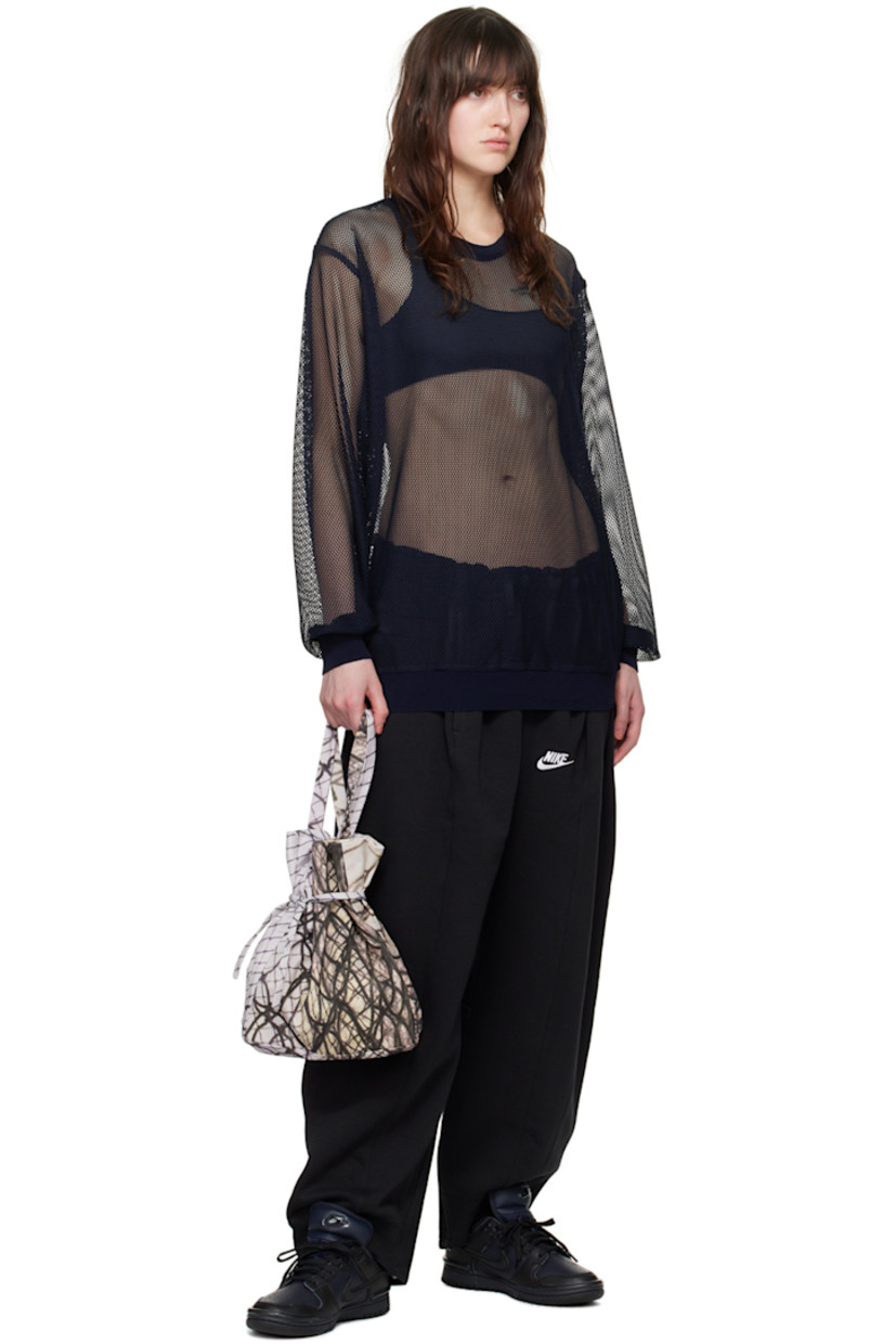 Sheer polyester mesh sweatshirt. 

· Rib knit crewneck, hem, and cuffs 
· Dropped shoulders 

Supplier color: Navy hexagon