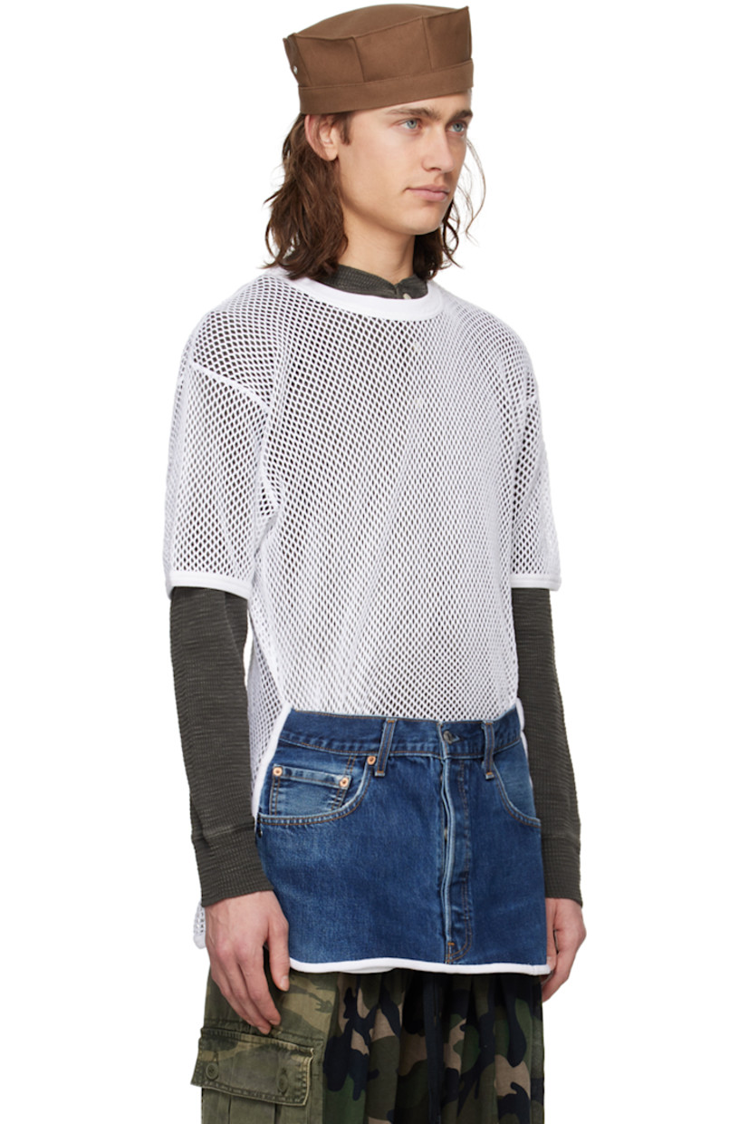 Paneled cotton semi-sheer mesh and upcycled non-stretch denim T-shirt. Rib knit trim and fading throughout.

· Crewneck
· Three-pocket styling
· Button-fly
· Shirttail hem
· Contrast stitching in tan

Supplier color: Denim blue/White