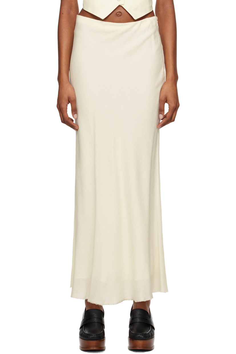 Wool- and silk-blend bouclé gauze skirt.

· Raw edge at hem
· Concealed zip closure at side seam
· Full silk satin lining

Supplier color: Ivory