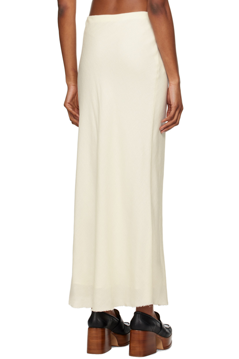 Wool- and silk-blend bouclé gauze skirt.

· Raw edge at hem
· Concealed zip closure at side seam
· Full silk satin lining

Supplier color: Ivory