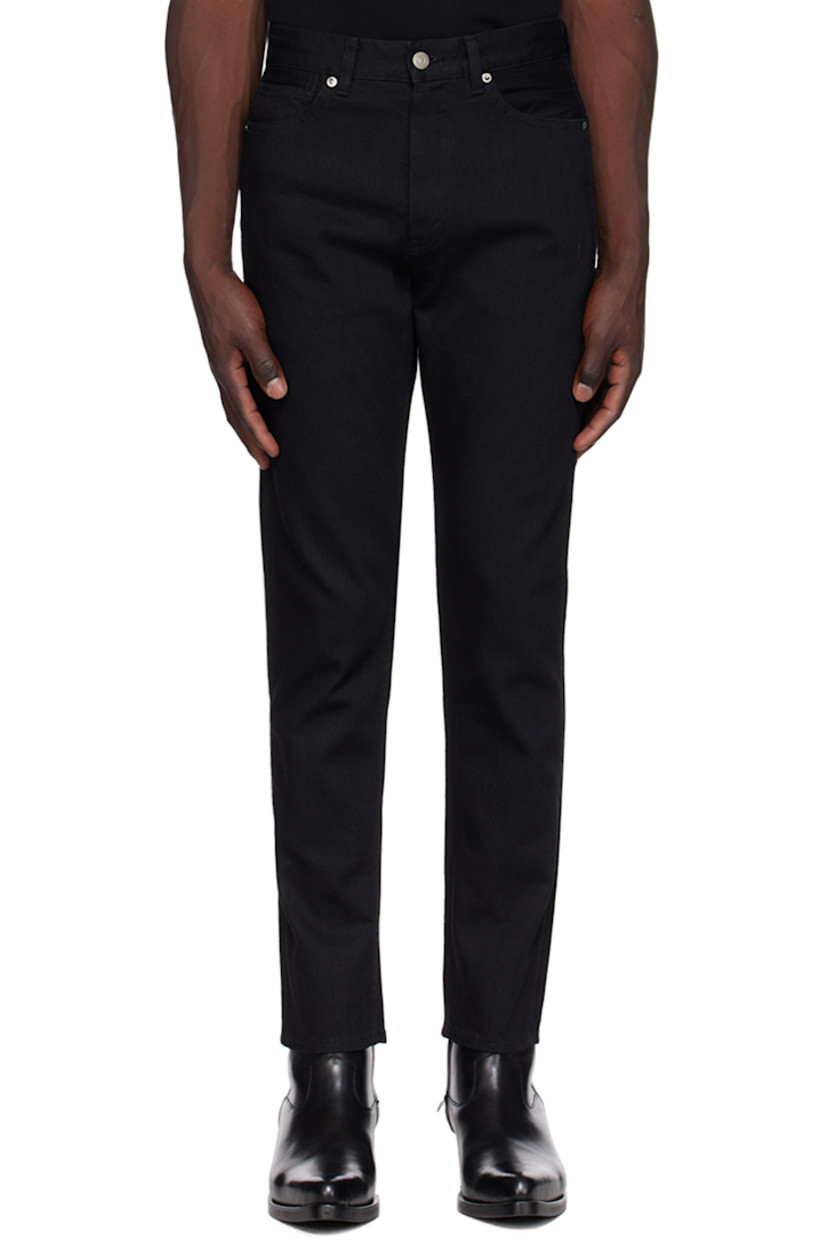 Tapered 11 oz stretch denim jeans.

· Belt loops
· Five-pocket styling
· Zip-fly
· Leather logo patch at back waistband
· Logo-engraved silver-tone hardware

Supplier color: Black